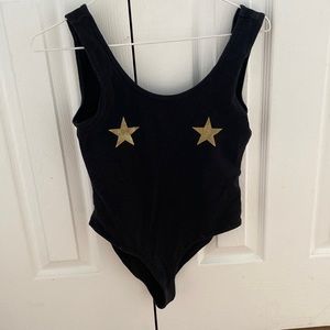 Black body suit with stars.